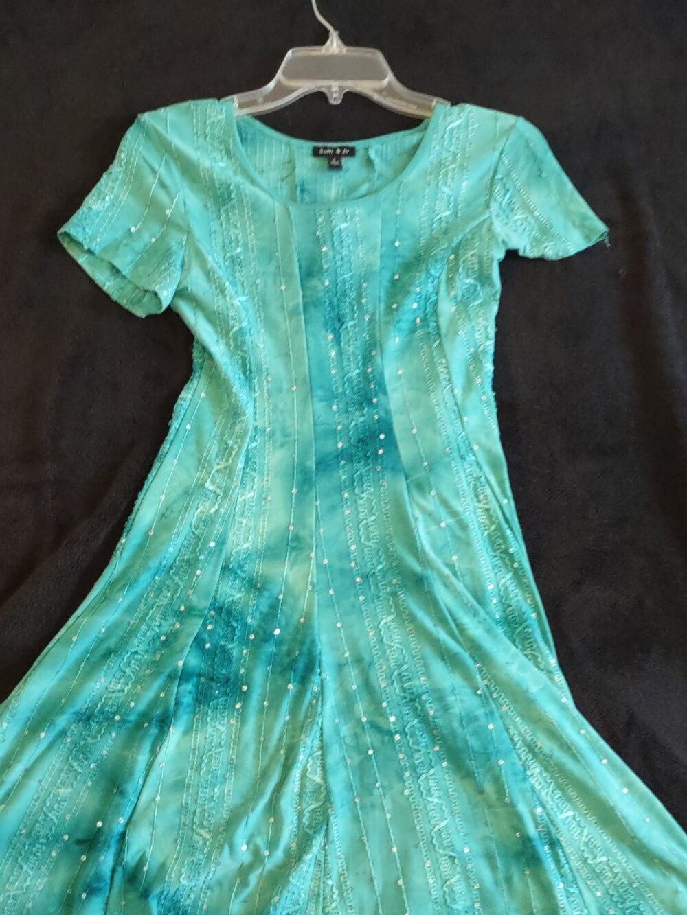 Women's aqua dress featuring sparkly ornamentation